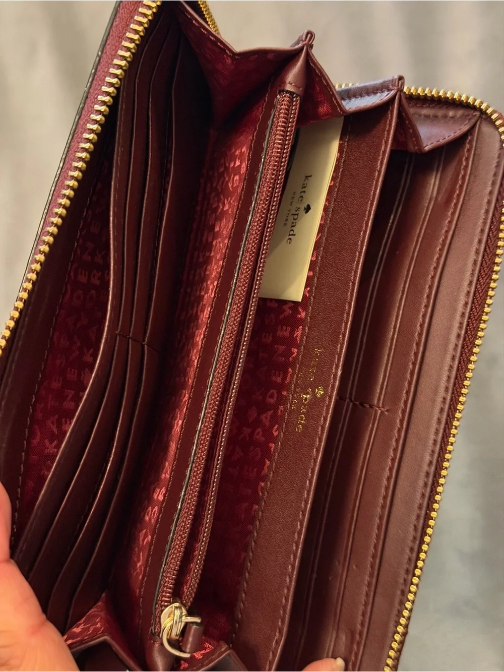 kate spade patent zip-around wallet in burgundy